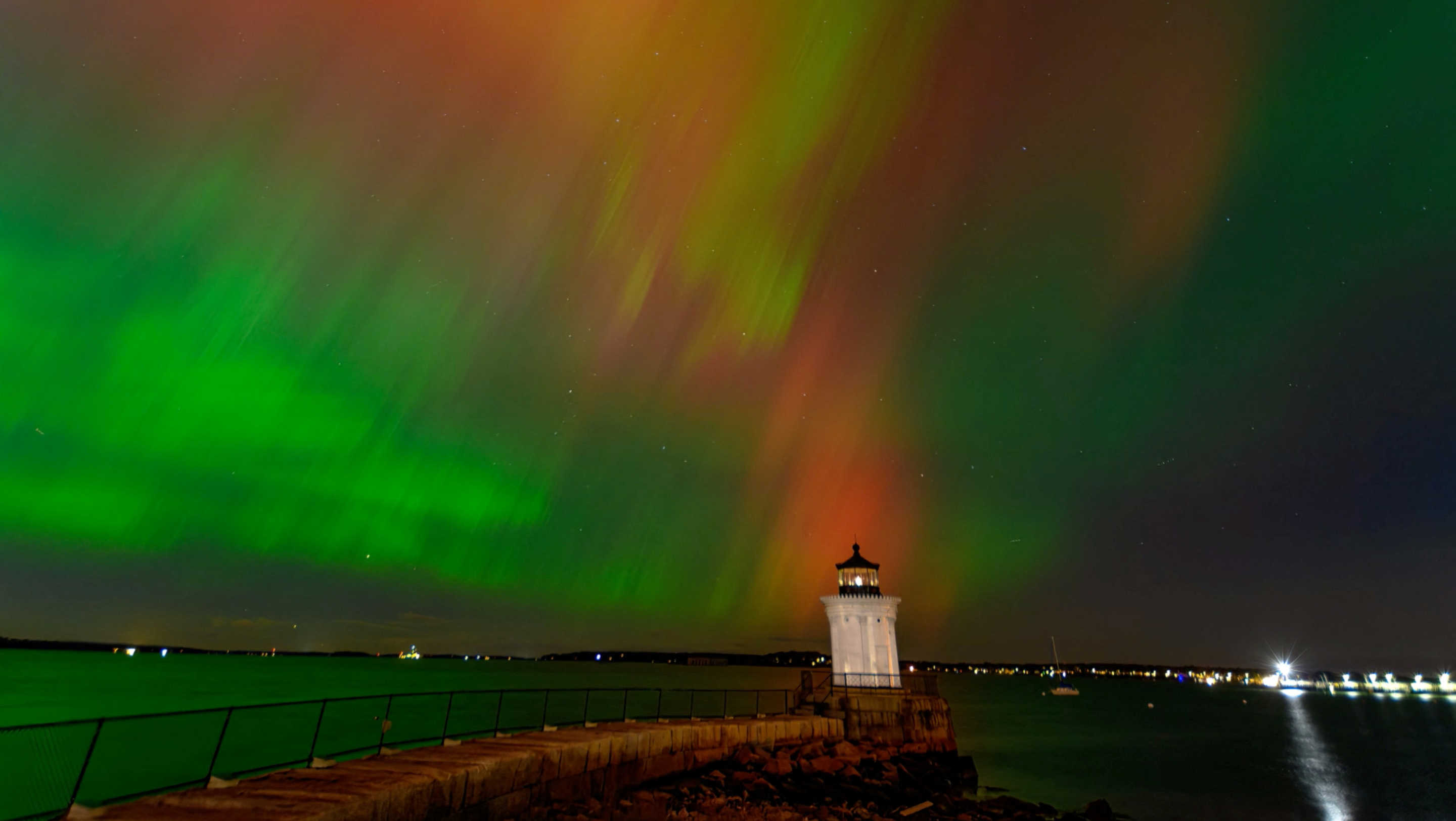 Northern Lights, also known as aurora borealis, light up the sky in Portland, Maine on October 10, 2024, in this still image obtained from a social media video. (@RobWrightImages via X/via Reuters)