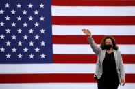 U.S. Democratic vice presidential nominee Senator Kamala Harris waves supporters as she arrives for a campaign drive-in rally in West Palm Beach