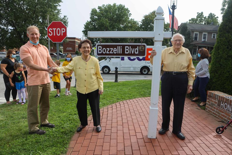 Cuyahoga Falls Mayor Don Walters is pictured with Madeline and Libert Bozzelli in a 2020 small ceremony to temporarily rename Broad Boulevard to Bozzelli Boulevard.