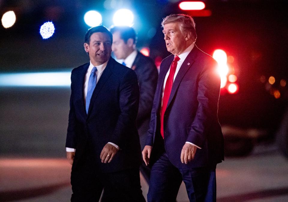 In 2019, Florida Gov. Ron DeSantis welcomes President Donald Trump to West Palm Beach.