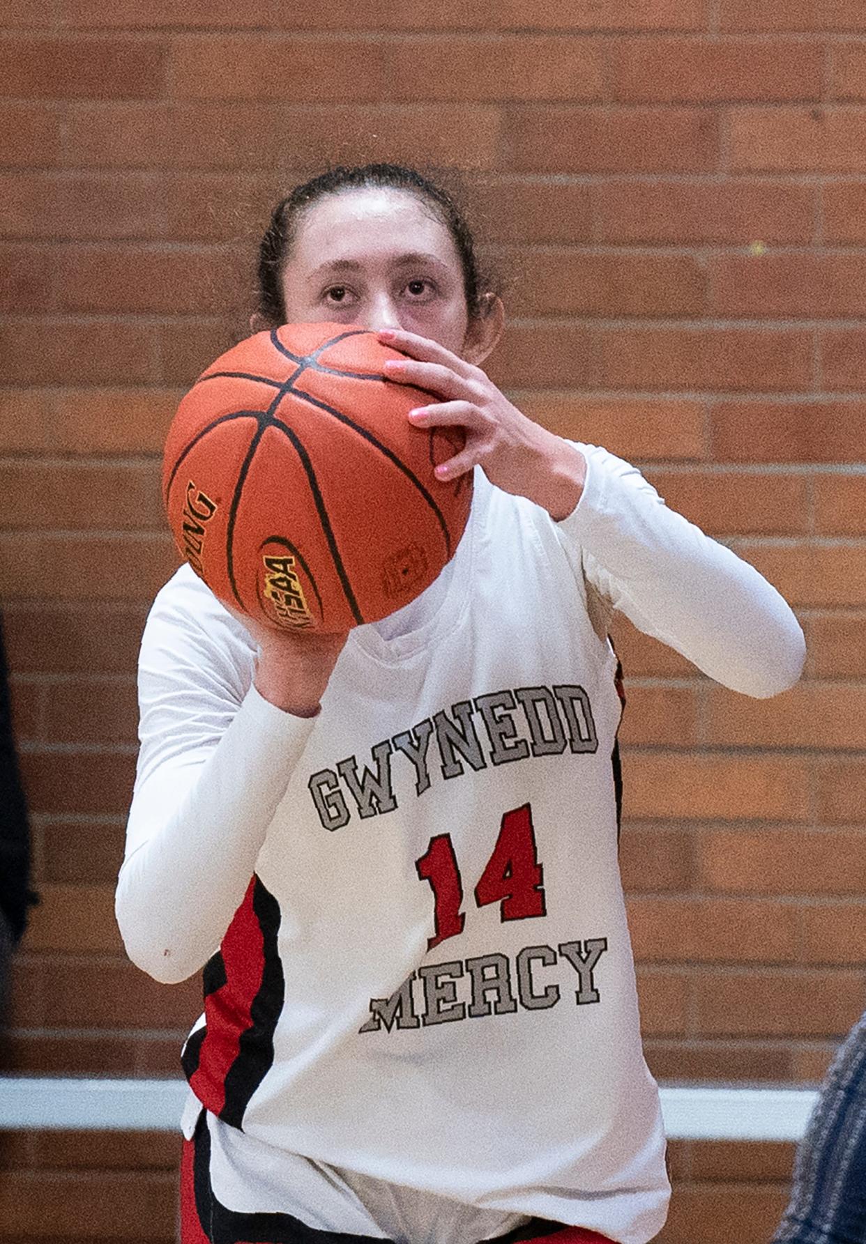 Gwynedd Mercy Academy's Emilia Coleman (14) against Liberty during their girls' basketball game in Lower Gwynedd on Thursday, Jan. 4, 2024.

Daniella Heminghaus | Bucks County Courier Times