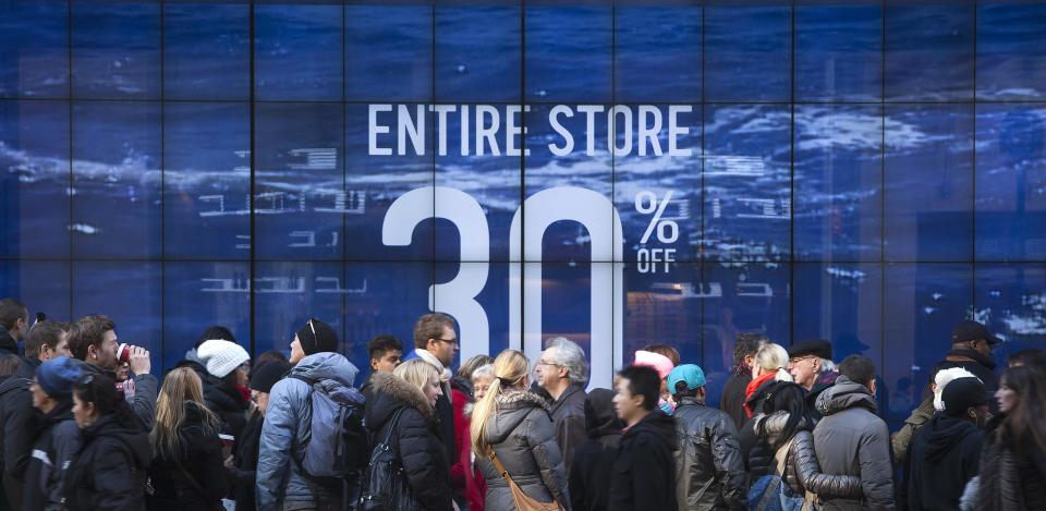 People line up to get into a store on 5th Ave. looking for Black Friday sales in New York November 29, 2013. Black Friday, the day following Thanksgiving Day holiday, has traditionally been the busiest shopping day in the United States. REUTERS/Carlo Allegri