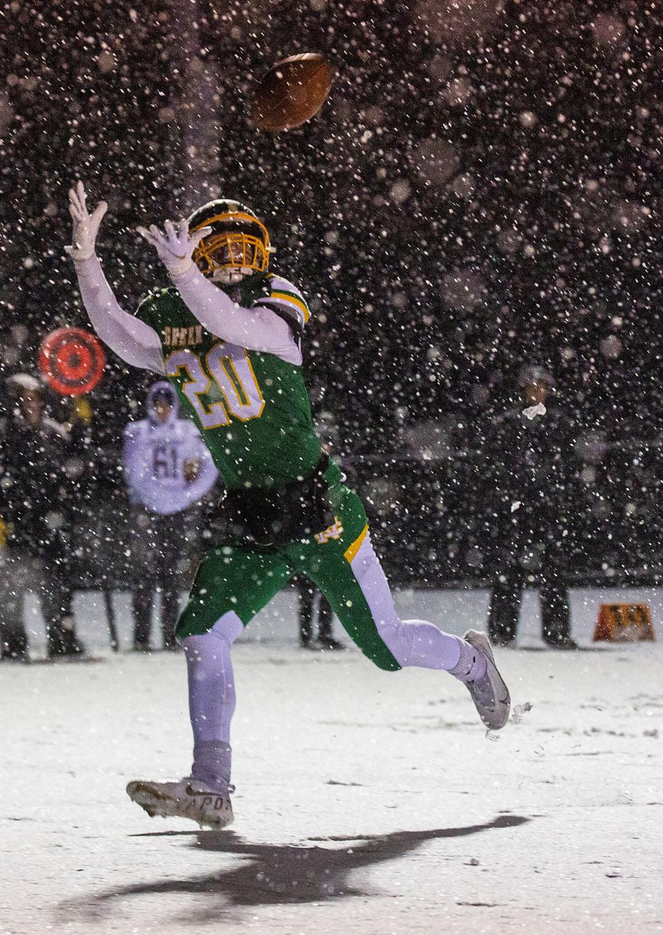 Newark Catholic senior Brandon Buchanan catches a touchdown pass against Warren JFK during a Division VII state semifinal at Marlington on Saturday, Nov. 27, 2021.