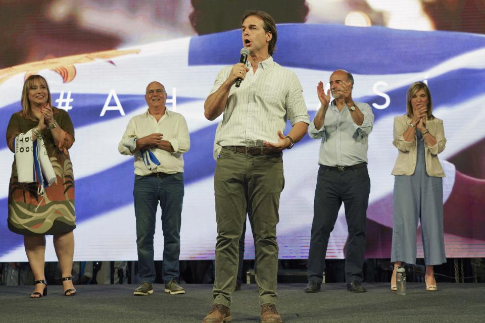 Uruguay's presidential candidate for the National Party Luis Lacalle Pou, center, speaks during his closing campaign rally in Las Piedras, Uruguay, Wednesday, Nov. 20, 2019. Uruguay will hold run-off presidential elections on Nov. 24 between presidencial candidate for the National Party, Luis Lacalle Pou and Daniel Martinez, of the ruling party Broad Front. (AP Photo/Matilde Campodonico)