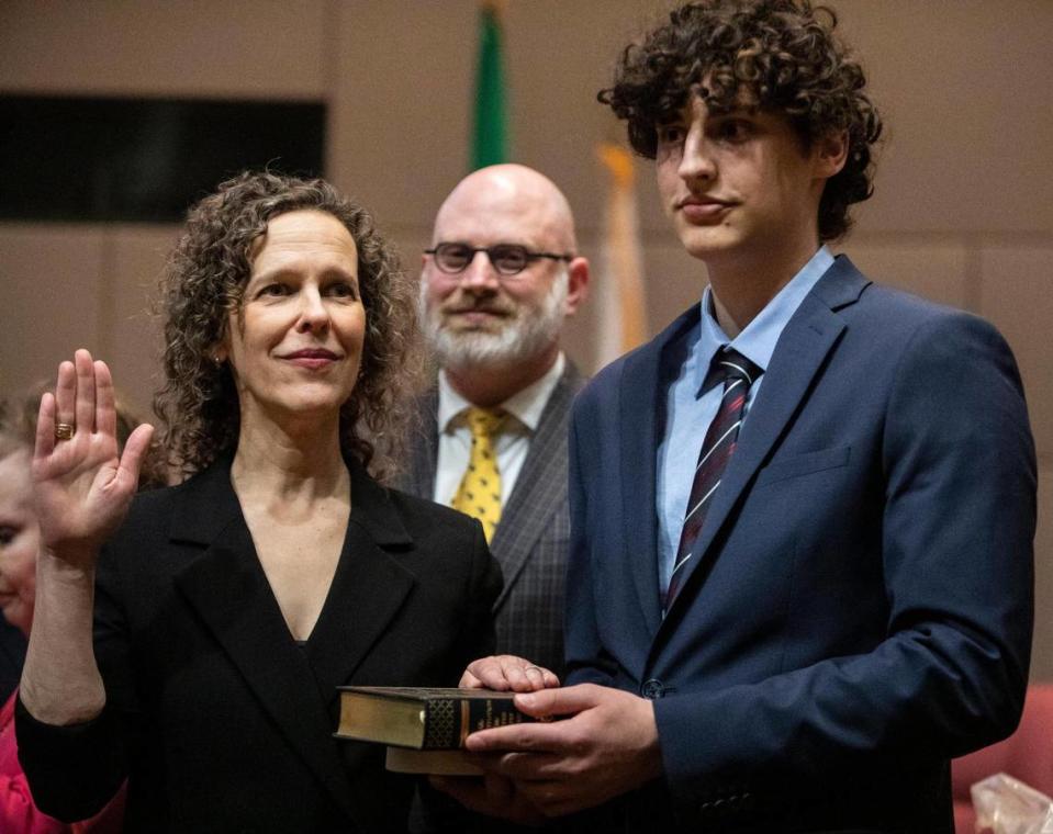 At-Large Commissioner Leigh Altman gets sworn in next to her family at the Charlotte-Mecklenburg Government Center Monday, Dec. 5 in Charlotte, NC. Makayla Holder/mholder@charlotteobserver.com