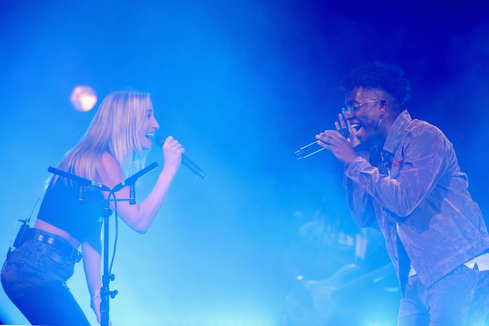 Ingrid Andress and BRELAND perform onstage for "BRELAND & Friends" benefit for Oasis Center presented by Amazon Music at Ryman Auditorium on April 04, 2023 in Nashville, Tennessee.