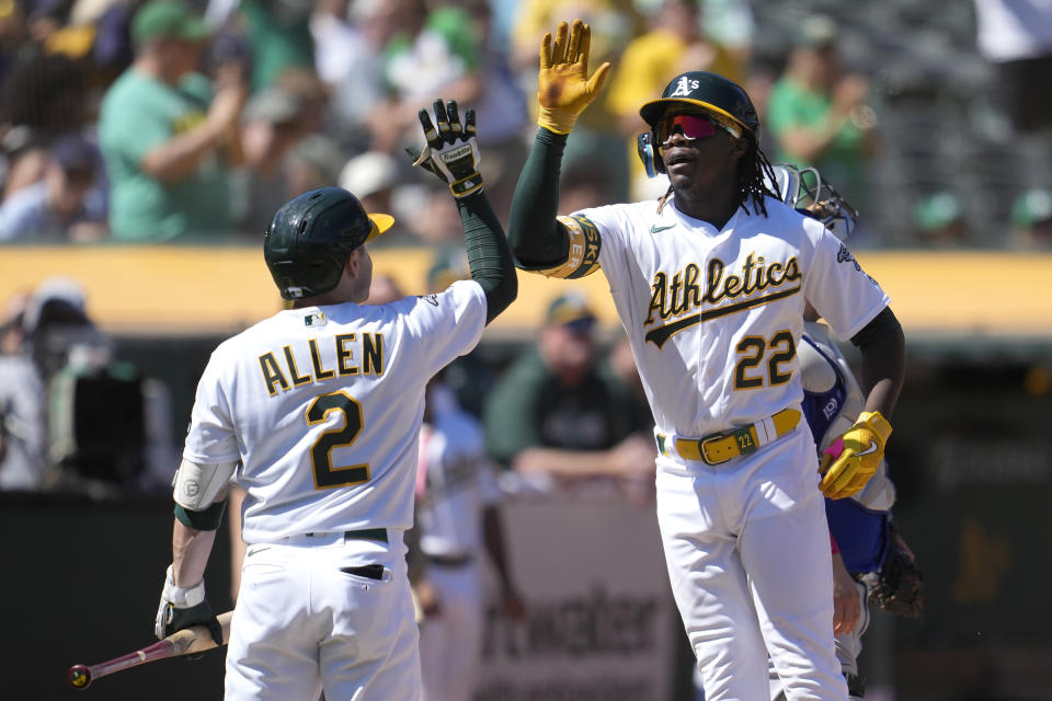 Oakland Athletics' Lawrence Butler (22) is congratulated by Nick Allen (2) after hitting a home run against the Toronto Blue Jays during the fifth inning of a baseball game in Oakland, Calif., Monday, Sept. 4, 2023. (AP Photo/Jeff Chiu)