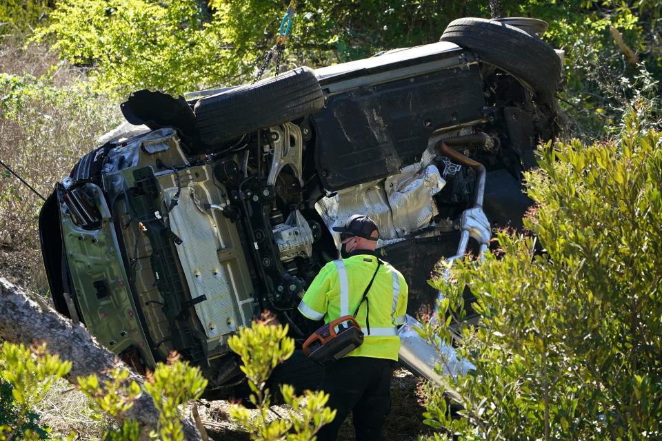 FILE - In this Feb. 23, 2021, file photo a vehicle rests on its side after a rollover accident involving golfer Tiger Woods, in Rancho Palos Verdes, Calif., a suburb of Los Angeles. The Los Angeles County sheriff says detectives have determined what caused Tiger Woods to crash his SUV last month in Southern California but would not release details on Wednesday, March 31, 2021, citing privacy concerns for the golf star. (AP Photo/Marcio Jose Sanchez, File)