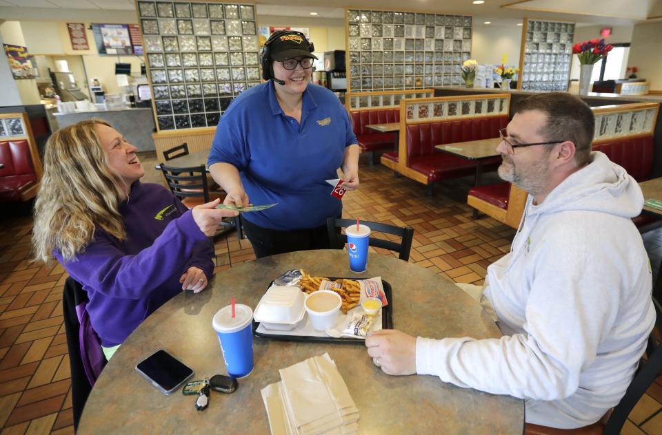 Shannon Jansen, center, serves a meal to Nichole and Joshua Wilson of Fond du Lac at Tuckers located at 927 S. Main Street Wednesday, April 20, 2022, in Fond du Lac.