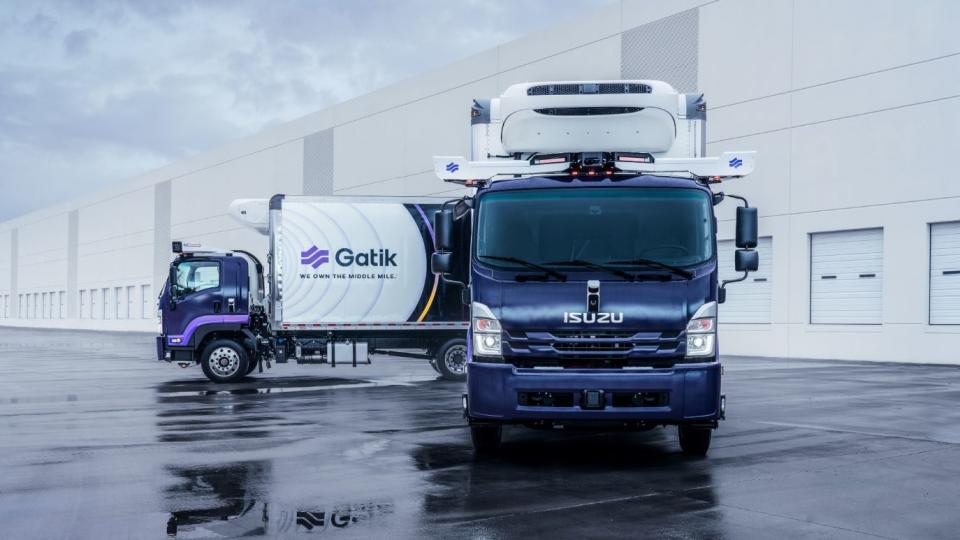 a few trucks parked in a parking lot