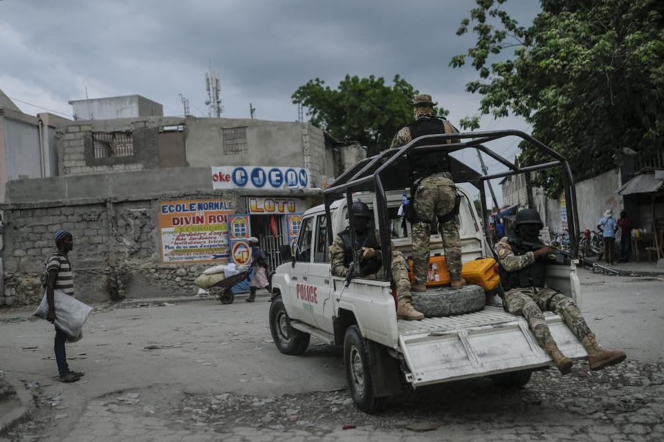 Security forces patrol the streets of Croix-des-Bouquets, near Port-au-Prince, Haiti, Tuesday, Oct. 19, 2021. A general strike continues in Haiti demanding that authorities address the nation’s lack of security, four days after 17 members of a U.S.-based missionary group were abducted by a gang. (AP Photo/Matias Delacroix)