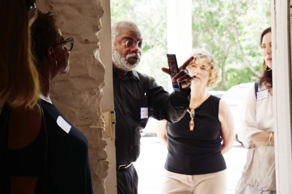 Joe McGill looks through the door of the limestone slave quarters behind the Neill-Cochran House.