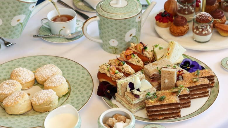 Tea sandwiches and scones plated