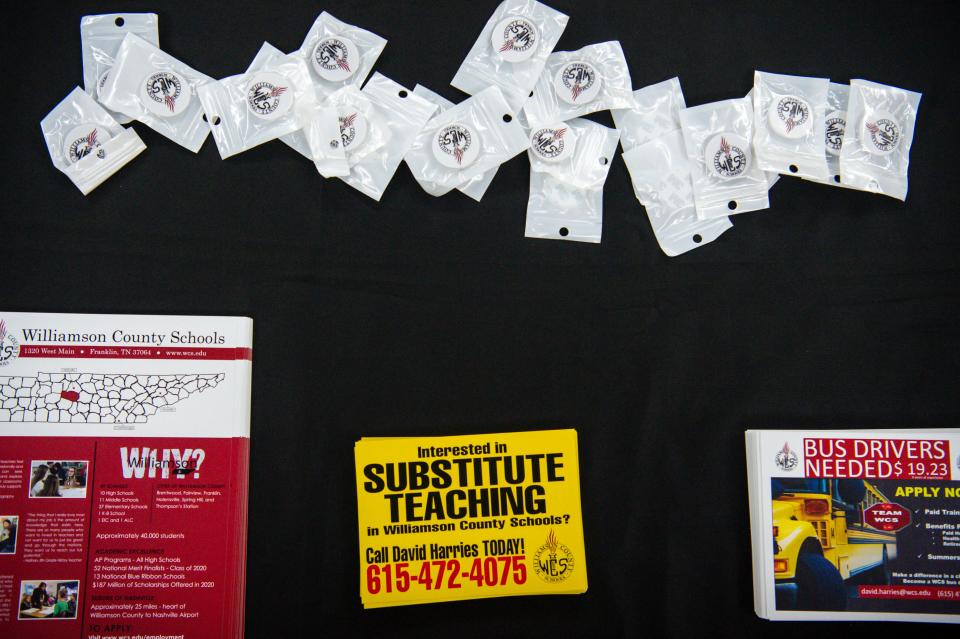 Materials are spread out on a table during a job fair for open classified positions at Williamson County Schools on Friday, July 23, 2021 held at Centennial High School in Franklin, Tenn.