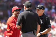 St. Louis Cardinals manager Oliver Marmol, left, argues with umpires Dan Bellino, center, and Andy Fletcher during the fifth inning of a baseball game against the Milwaukee Brewers Saturday, May 28, 2022, in St. Louis. (AP Photo/Jeff Roberson)