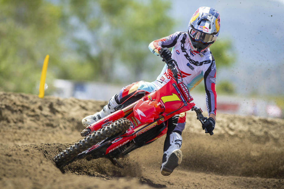 In this photo provided by MX Sports Pro Racing, Australian racer Jett Lawrence prepares for his title defense of the Pro Motocross Championship at Fox Raceway in Pala, Calif., Thursday, May 23, 2024. Motocross racing is a symbiotic relationship between rider and dirt bike. “He grew up dancing and he's so fluid it's almost like he's dancing across the race track,” said Davey Coombs, president of MX Sports Pro Racing. (Simon Cudby/MX Sports Pro Racing via AP)