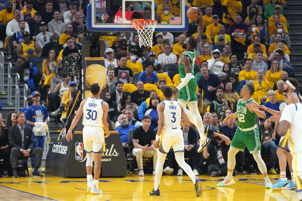 Game 1: Celtics guard Jaylen Brown (7) throws down a one-handed slam during the first half.