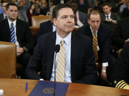 FBI Director James Comey waits before testifying at a House Intelligence Committee hearing into alleged Russian meddling in the 2016 U.S. election, on Capitol Hill. REUTERS/Joshua Roberts