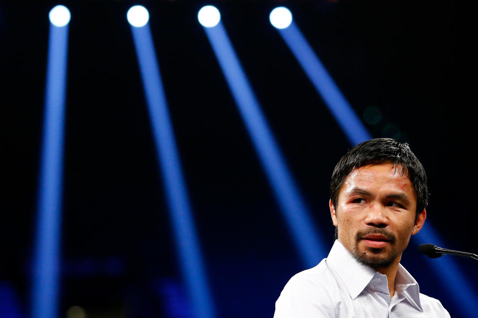 LAS VEGAS, NV - MAY 02: Manny Pacquiao answers questions during the post-fight news conference after losing to Floyd Mayweather Jr. in their welterweight unification championship bout on May 2, 2015 at MGM Grand Garden Arena in Las Vegas, Nevada. Al Bello/Getty Images/AFP (AFP Photo/AL BELLO)