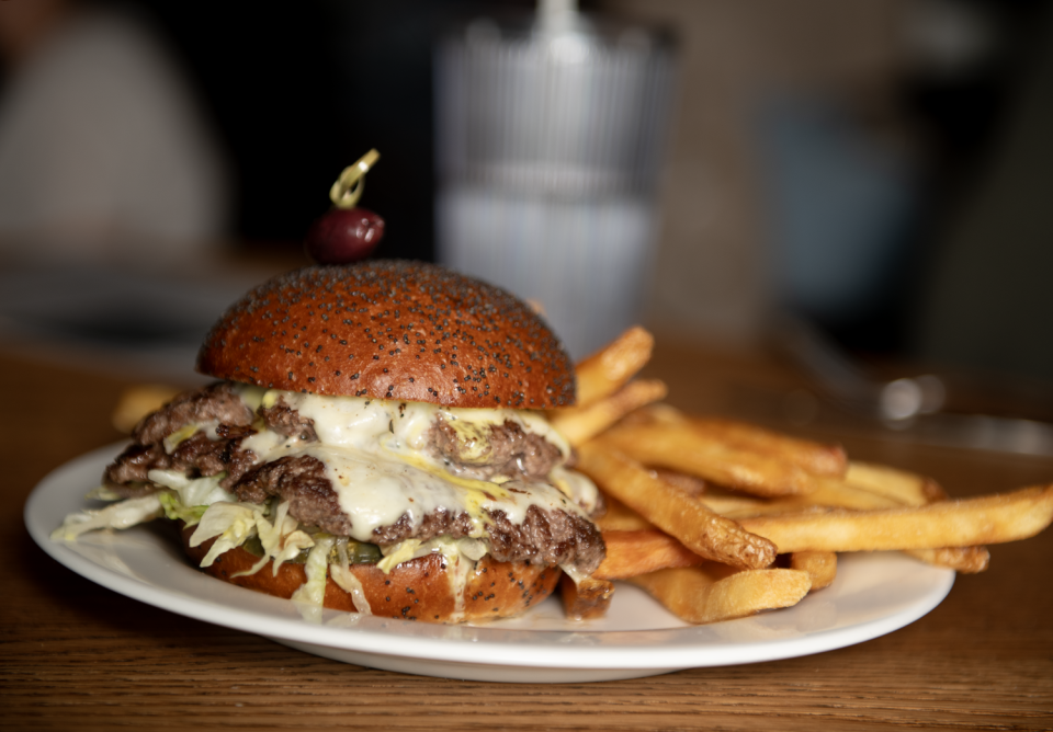 The Good One is a double cheeseburger with griddled onions, malted pickles and more at Good Company in Akron.