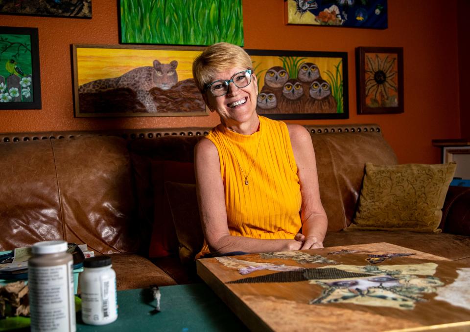 Ulrike poses for a photo on her couch in her home studio in Palm Springs, Calif., Wednesday, Sept. 21, 2022. 