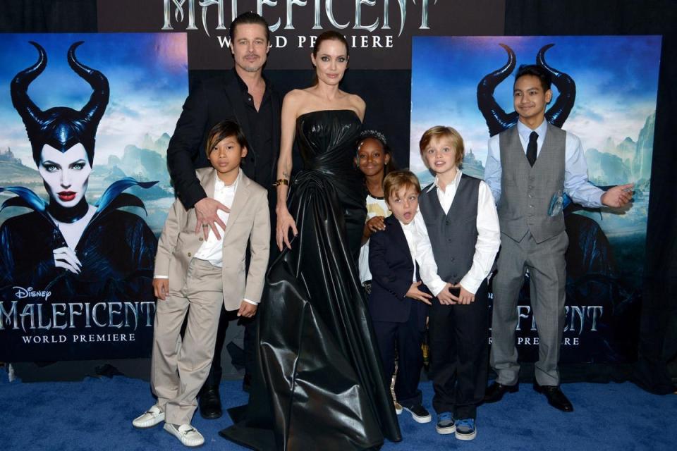 Brad Pitt and Angelina Jolie (C) with children (L-R) Pax Jolie-Pitt, Zahara Jolie-Pitt, Knox Jolie-Pitt, Shiloh Jolie-Pitt and Maddox Jolie-Pitt attend the premiere of Disney's 