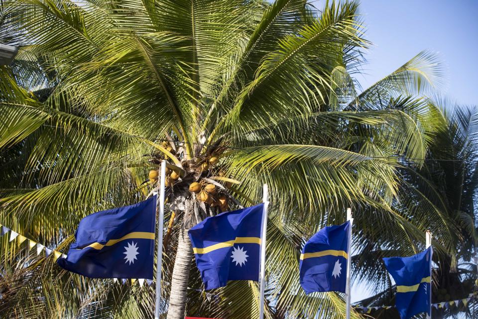 FILE - This shows national flags in Nauru for the Pacific Islands Forum on the tiny Pacific nation of Nauru, on Sept. 3, 2018. China’s Foreign Ministry said Wednesday, Jan. 24, 2024 that Beijing has formally restored diplomatic ties with Nauru after the tiny Pacific island nation cut its ties with Taiwan earlier this month. (Jason Oxenham/Pool Photo via AP, File)