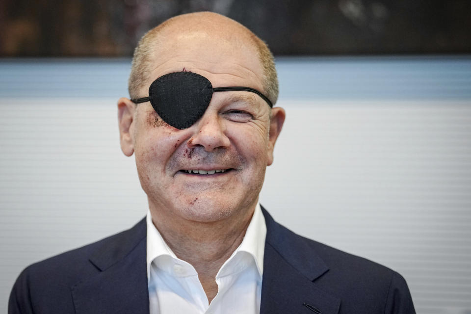 German Chancellor and member of the German Social Democratic Party (SPD), Olaf Scholz, attends his party's federal parliamentary group meeting at the Reichstag building, home of the German federal parliament, Bundestag, in Germany, Monday, Sept. 4, 2023. German Chancellor Olaf Scholz has tweeted a pirate-style picture of himself with a black eye patch and dark-red bruises on the right side of his face — the result of a jogging accident on the weekend. The chancellor wrote Monday in the caption of the photo that he was “excited to see the memes.” (Kay Nietfeld/dpa via AP)