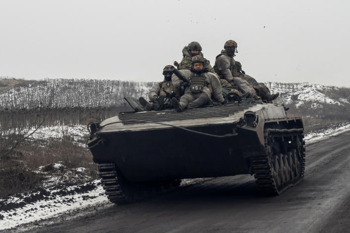 Ukrainian servicemen ride atop an infantry fighting vehicle along a road, amid Russia&#39;s attack on Ukraine, near a frontline in Donetsk region, Ukraine January 30, 2023. REUTERS/Viacheslav Ratynskyi