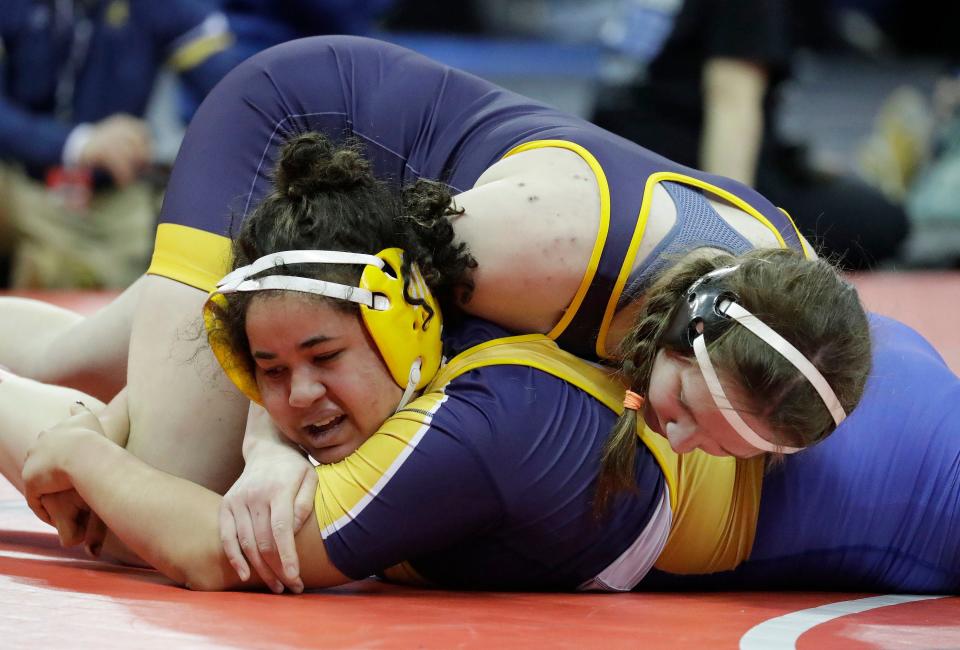 Wausau West’s Christina Nordstrom, top, grips Sheboygan North’s Destiny Duesterbeck in a 185-pound match during the WIAA Individual State Wrestling at the Kohl Center, Thursday, February 23, 2023, in Madison, Wis.