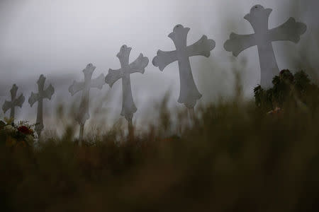 Crosses are seen placed at a memorial in memory of the victims killed in the shooting at the First Baptist Church of Sutherland Springs in Sutherland Springs, Texas, U.S., November 8, 2017. REUTERS/Jonathan Bachman
