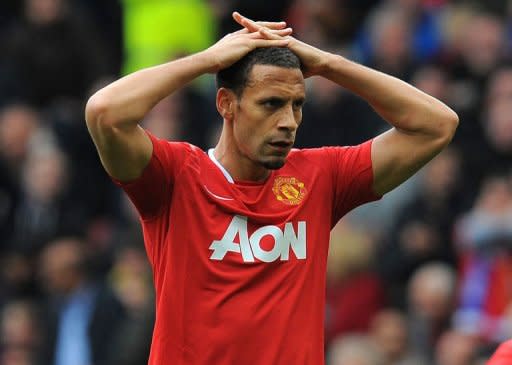 Manchester United's English defender Rio Ferdinand reacts during the English Premier League football match between Manchester United and Everton at Old Trafford in Manchester. Manchester City made the most of Manchester United dropping points against Everton on Sunday to move within three points of the Premier League leaders by beating Wolves