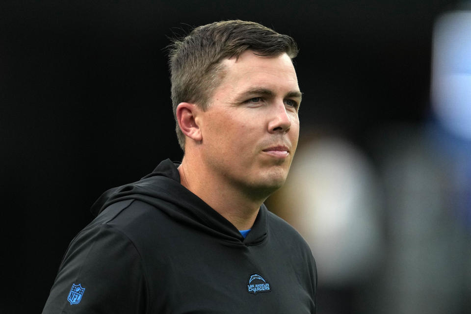 Aug 12, 2023; Inglewood, California, USA; Los Angeles Chargers offensive coordinator Kellen Moore watches during the game against the Los Angeles Rams at SoFi Stadium. Mandatory Credit: Kirby Lee-USA TODAY Sports