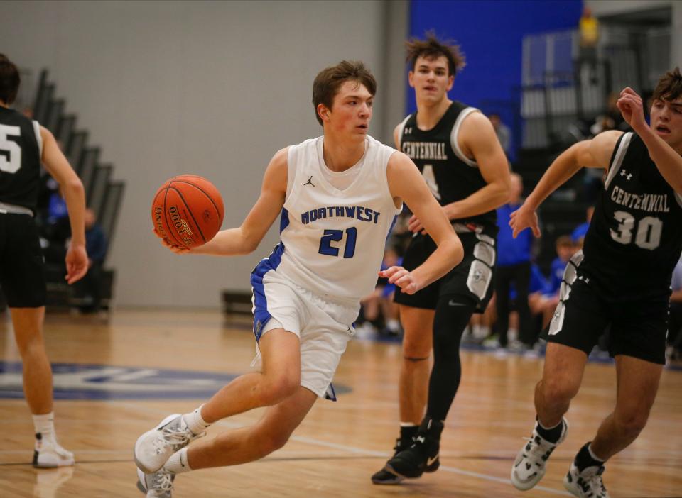 Waukee Northwest junior Pryce Sandfort drives the ball inside against Ankeny Centennial in the first quarter at Waukee Northwest High School in Waukee on Tuesday, Dec. 21, 2021.