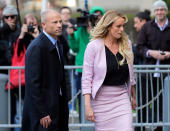 FILE - In this April 16, 2018 file photo, Stormy Daniels, right, and her attorney Michael Avenatti turn from the microphones after speaking as they leave federal court in New York. Avenatti, the trash-talking lawyer who became a household name by representing a porn star and hounding Donald Trump, is now in the legal fight of his life against federal charges that could send him to prison for the rest of his life. (AP Photo/Seth Wenig, File)