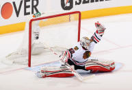 GLENDALE, AZ - APRIL 14: Goaltender Corey Crawford #50 of the Chicago Blackhawks makes a glove save on the shot from the Phoenix Coyotes in second period of Game Two of the Western Conference Quarterfinals during the 2012 NHL Stanley Cup Playoffs at Jobing.com Arena on April 14, 2012 in Glendale, Arizona. (Photo by Christian Petersen/Getty Images)