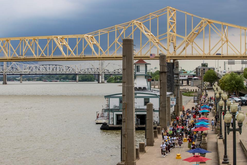 Residents participate in the "A Journey in Our Footprints" march to the (Un)Known Project site on Juneteenth. June 19, 2021