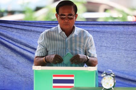 FILE PHOTO: Thailand's Prime Minister Prayuth Chan-ocha casts his ballot to vote in the general election at a polling station in Bangkok