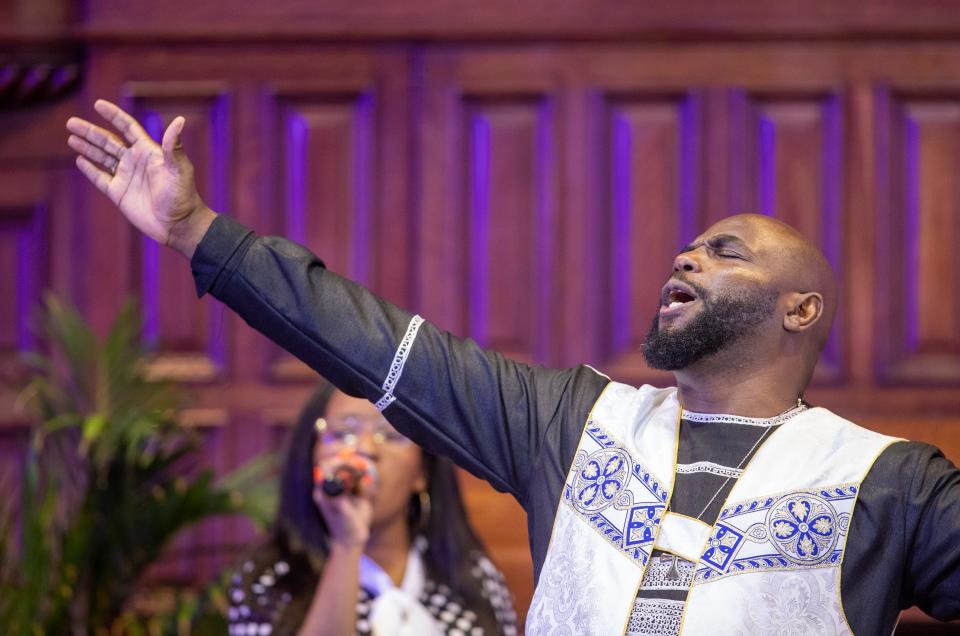 Pastor Carlos Perkins who has made education about mental health issues paramount at Bethel Cathedral AME, leads Sunday service in Indianapolis, Nov. 7, 2021. 