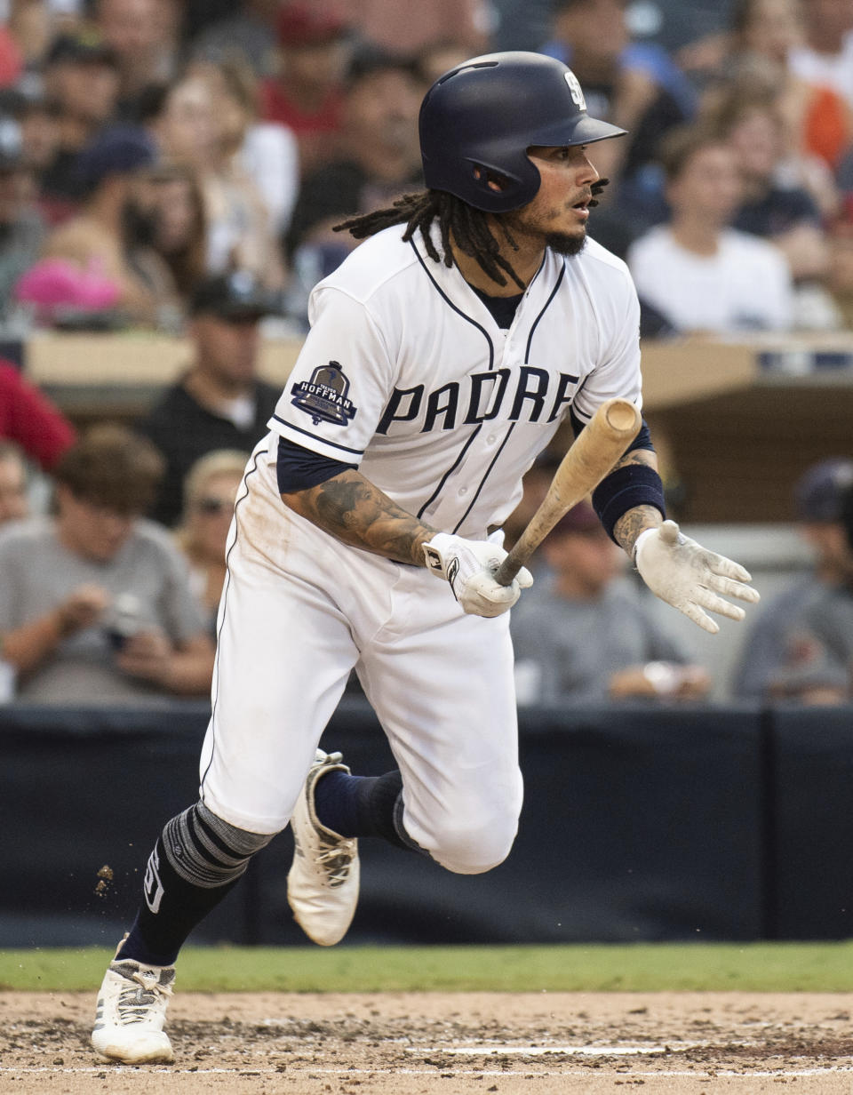 San Diego Padres' Freddy Galvis hits a two-run single during the fourth inning of a baseball game against the Arizona Diamondbacks in San Diego, Saturday, Aug. 18, 2018. (AP Photo/Kyusung Gong)