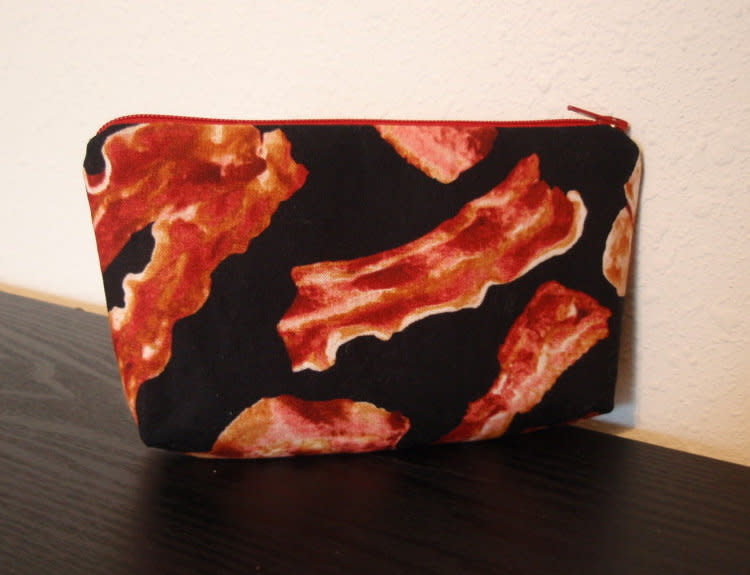 Your face doesn't have to look greasy, even if your favorite food is.   <a href="http://www.etsy.com/listing/99706708/bacon-zipper-cosmetic-pouch-small?ref=sr_gallery_43&ga_search_query=bacon&ga_view_type=gallery&ga_ship_to=US&ga_page=26&ga_search_type=all">Etsy</a>, <strong>$10</strong>