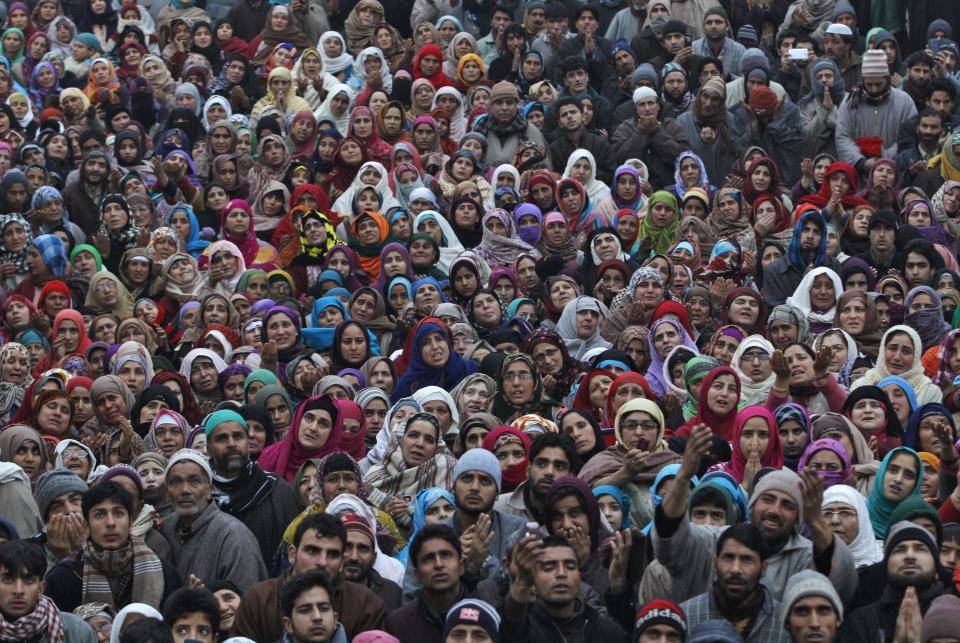 Kashmiri Muslims pray upon seeing a relic of Prophet Mohammad being displayed to devotees during the festival of Eid-e-Milad-ul-Nabi at Hazratbal shrine on a cold winter morning in Srinagar January 14, 2014. Thousands of Kashmiri Muslims on Tuesday thronged to the shrine of Hazratbal, which houses a relic believed to be a hair from the beard of Prophet Mohammad, to celebrate Eid-e-Milad-ul-Nabi, the Prophet's birth anniversary. REUTERS/Danish Ismail (INDIAN-ADMINISTERED KASHMIR - Tags: RELIGION SOCIETY TPX IMAGES OF THE DAY)