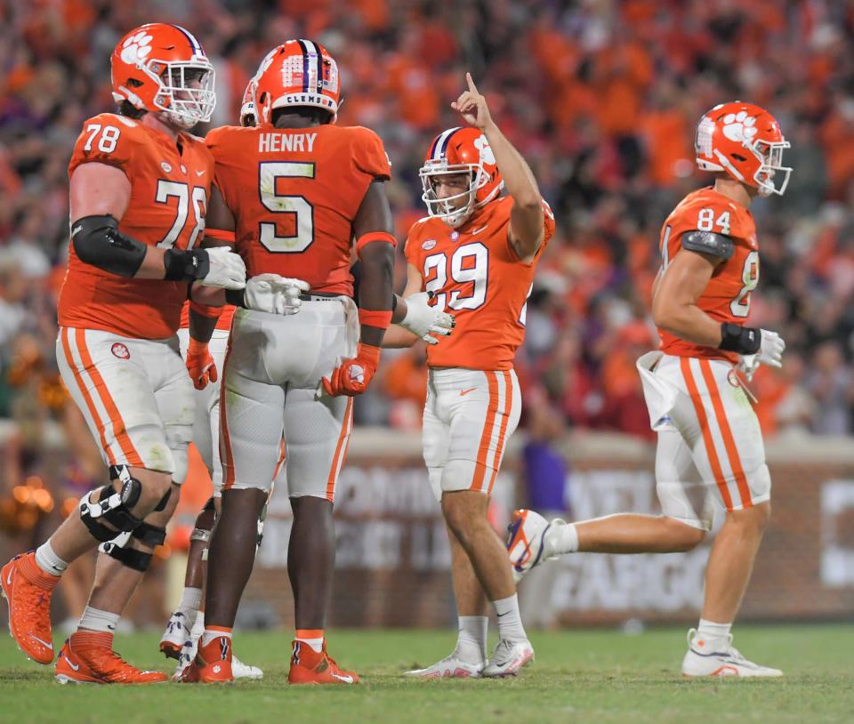 Clemson kicker B.T. Potter (29) reacts after making a field goal against North Carolina State during the fourth quarter at Memorial Stadium.