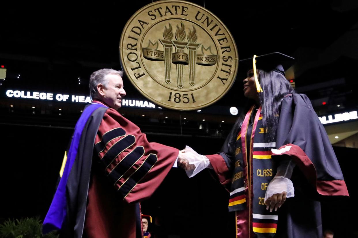 Florida State University graduates are recognized as they walk across the stage during the Spring 2022 Commencement Ceremony Saturday, April 30, 2022.