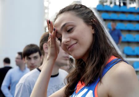 FILE PHOTO: Athletics - Russian Athletics Cup - Women's high jump - Meteor Stadium, Zhukovsky, Russia, 21/7/16. Maria Kuchina of Russia reacts as she talks to the media. REUTERS/Tatyana Makeyeva/File Photo