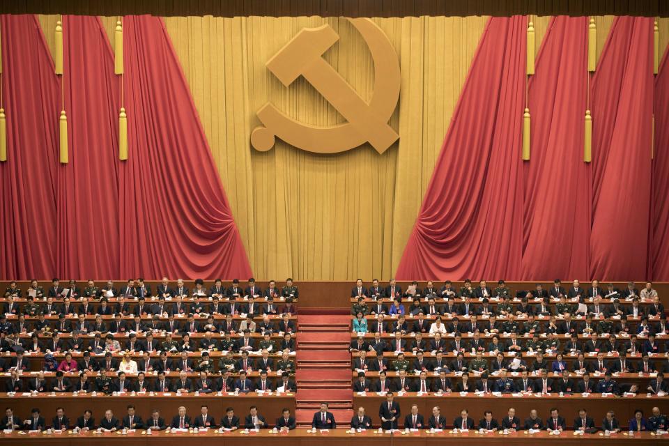 FILE - Chinese President Xi Jinping, center, presides over the opening ceremony of the 19th Party Congress held at the Great Hall of the People in Beijing on Oct. 18, 2017. The just-concluded Winter Olympics weren’t China's big event of the year, internally, at least. For the Communist Party, that comes this fall at a major meeting that will likely cement Xi Jinping's position as one of the nation's most powerful leaders in its seven decades of Communist rule. (AP Photo/Ng Han Guan, File)