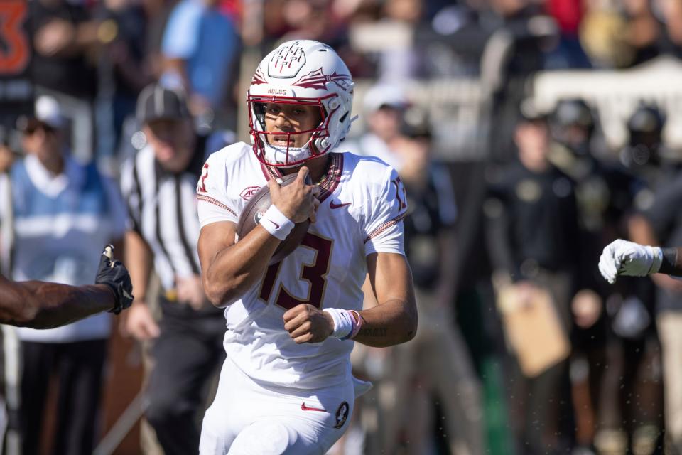 Florida State Seminoles quarterback Jordan Travis (13) scrambles for a touchdown during the NCAA football game between the Florida State Seminoles and the Wake Forest Demon Deacons. Jonathan Huff/CSM (Credit Image: © Jonathan Huff/Cal Sport Media) (Cal Sport Media via AP Images)