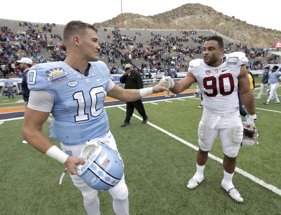 North Carolina QB Mitchell Trubisky, left, and Stanford DL Solomon Thomas could both end up top-10 picks. (AP)