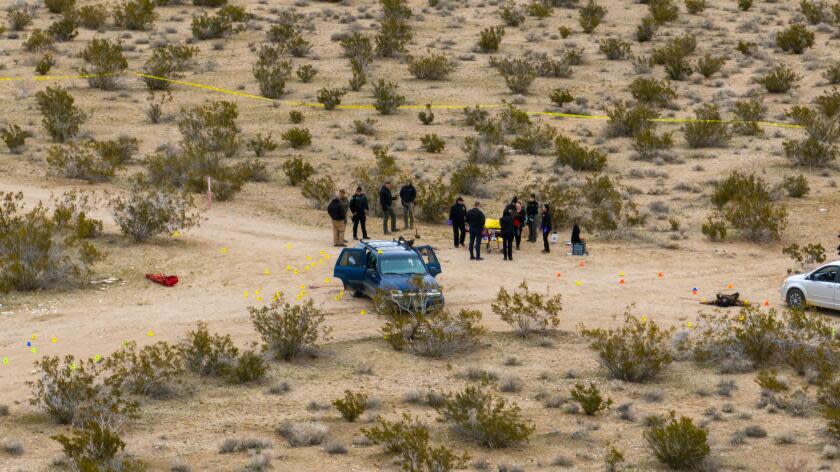 Adelanto, CA - January 24: San Bernardino sheriff's department officials investigate scene where five were found dead in a remote area of SanBernardino county north of Adelato January 24, 2024. (Brian van der Brug / Los Angeles Times)