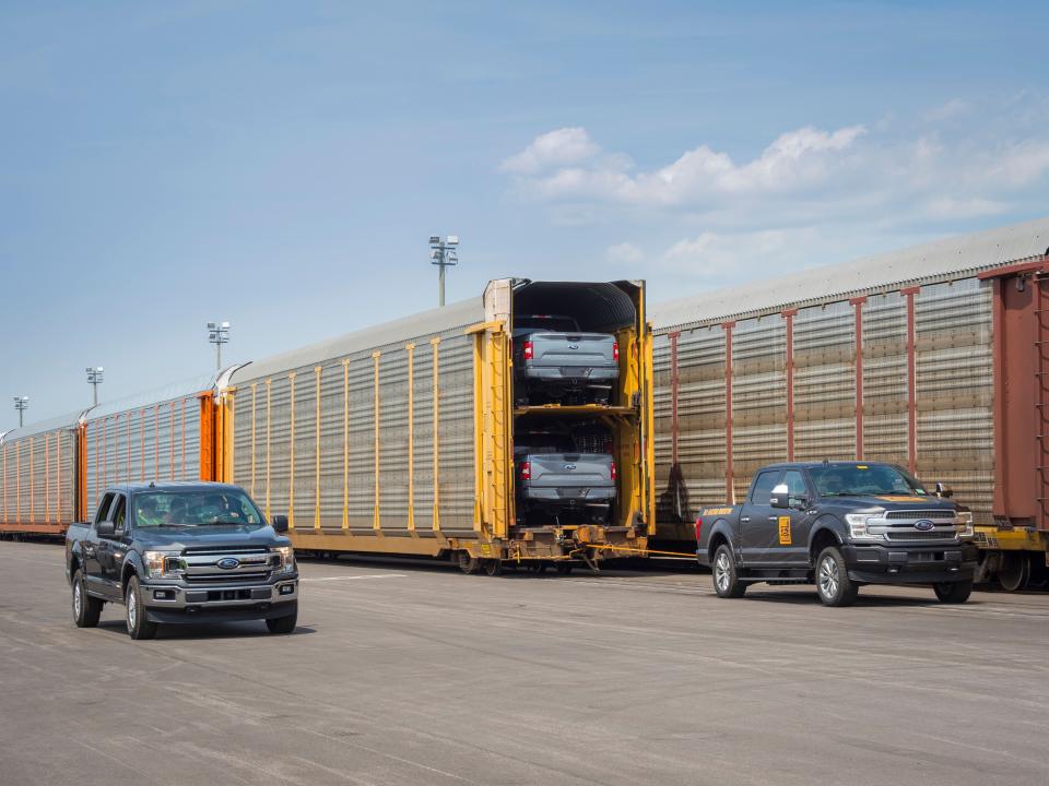 Ford's pick-up tows train full of F-150s.